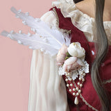 Lolita Rosette Brooch with Feather and Chain by Infanta